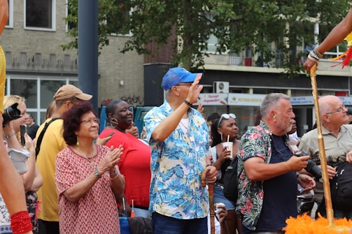A crowd enjoying a street performance at an event.