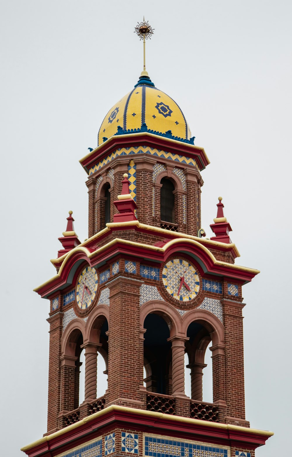 brown tower clock under white sky