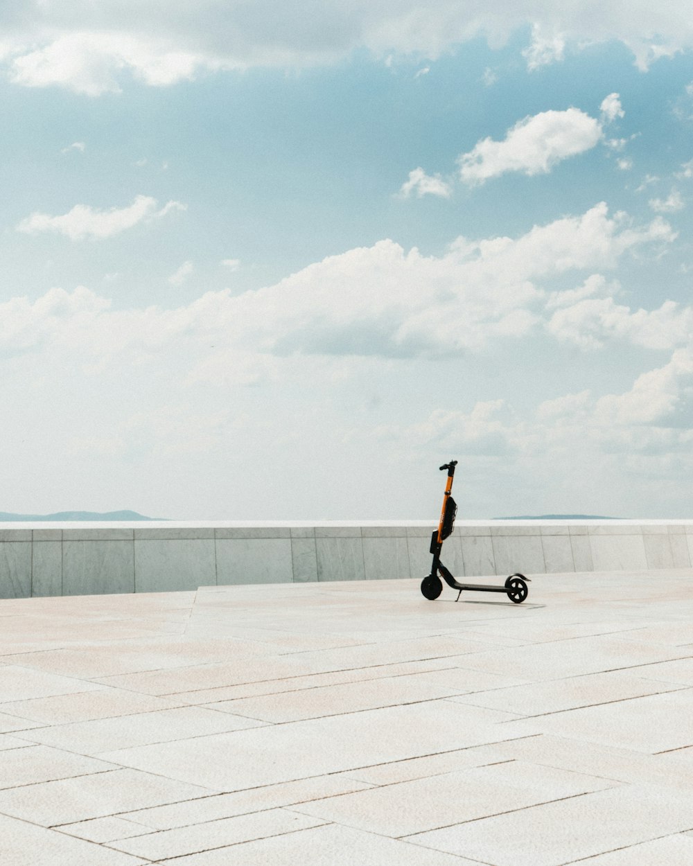 black kick scooter parked on concrete floor