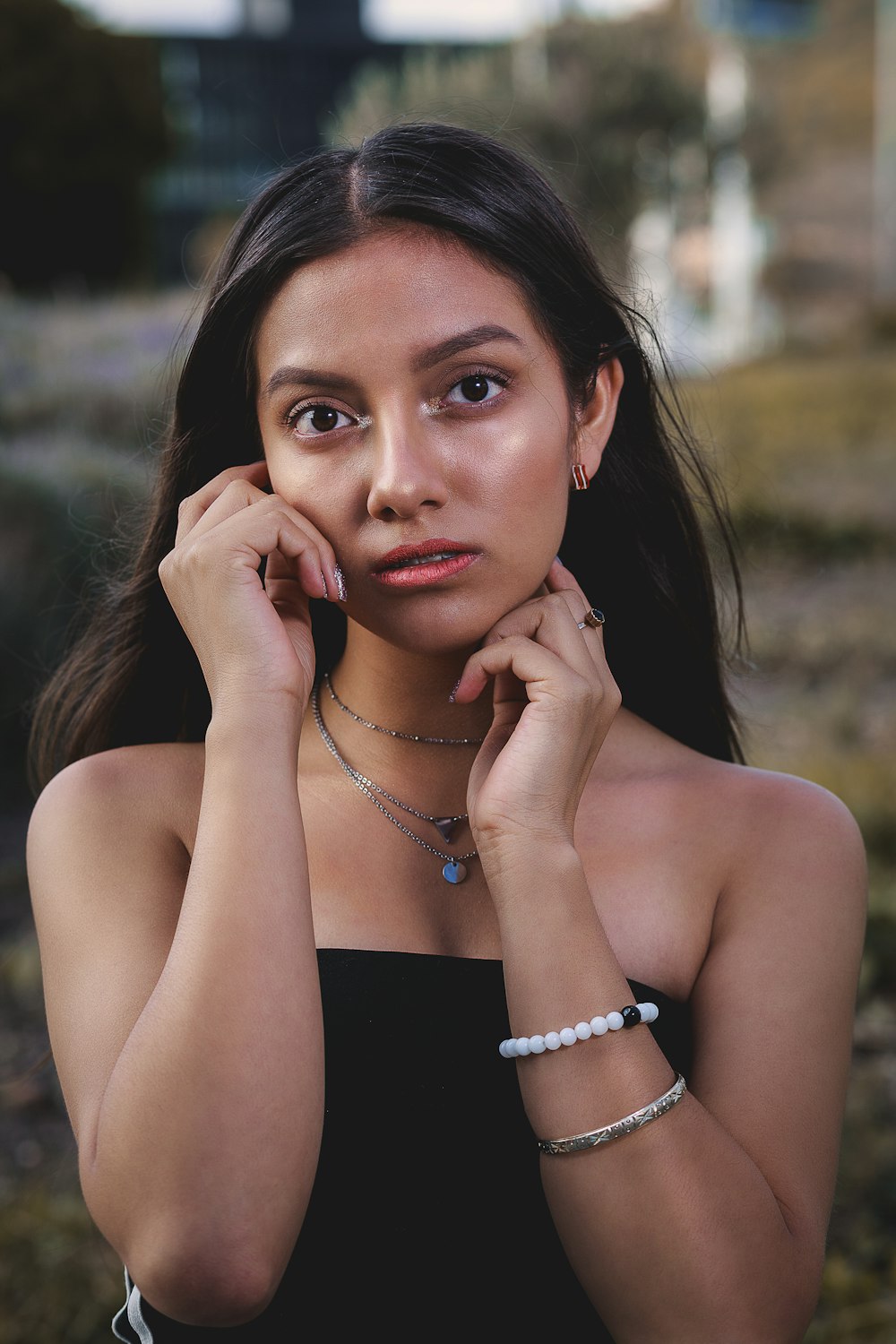 shallow focus photo of woman in black strapless top