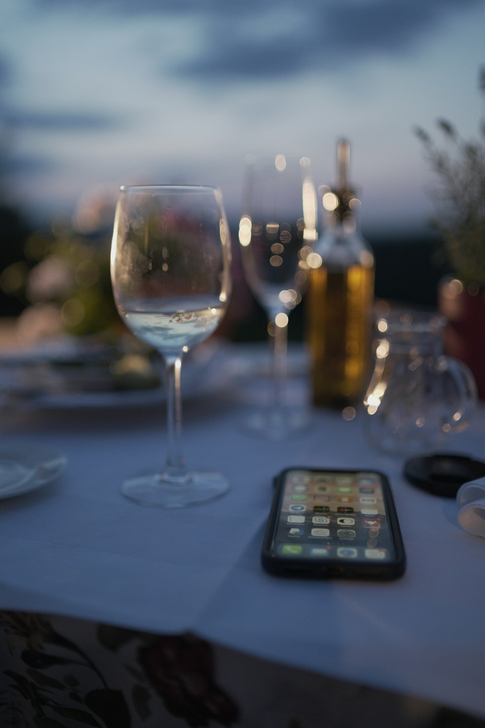 glass of wine near iPhone on table