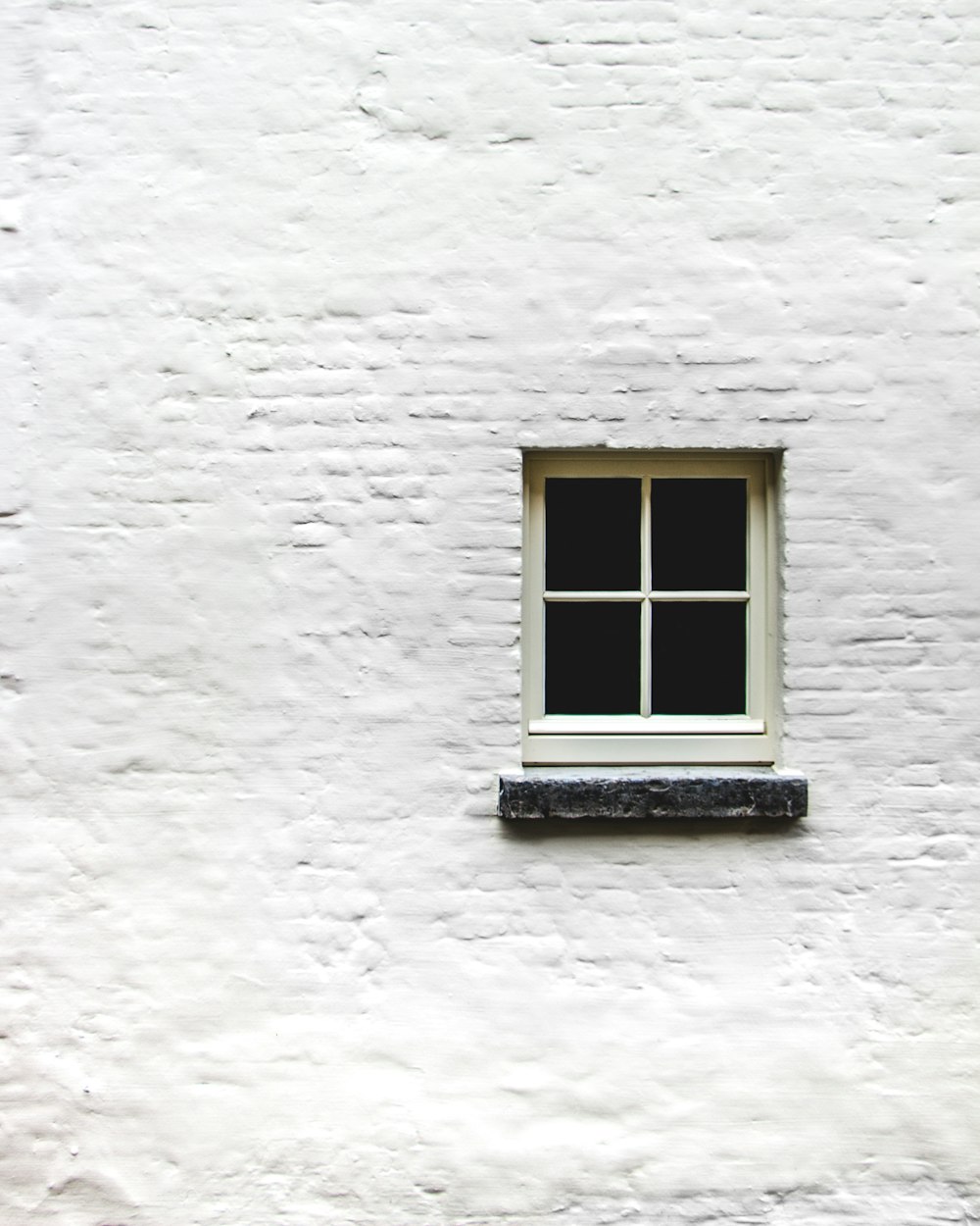white wall with window close-up photography