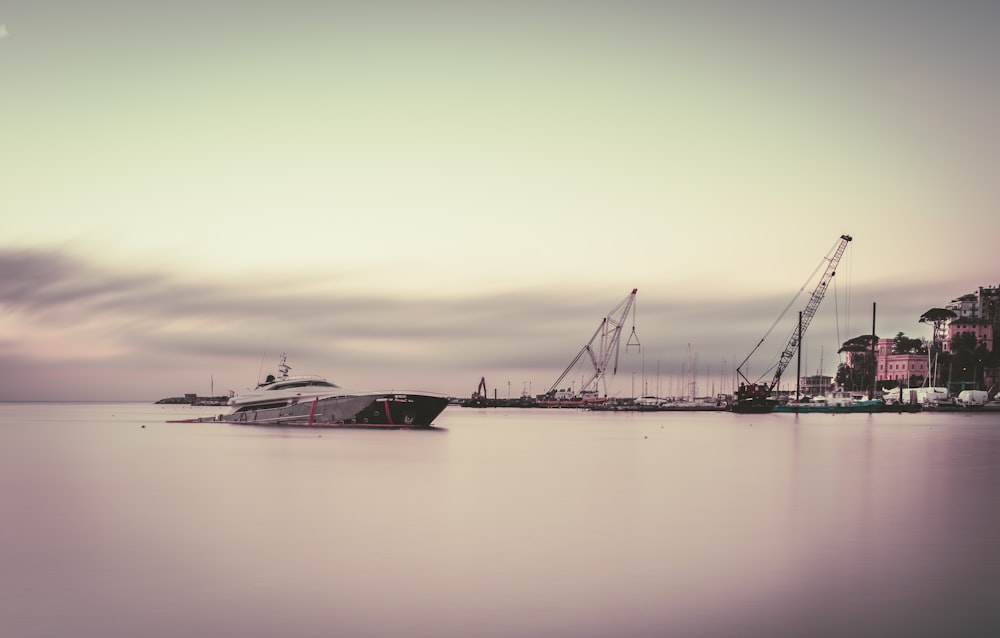 gray boat in body of water during daytime