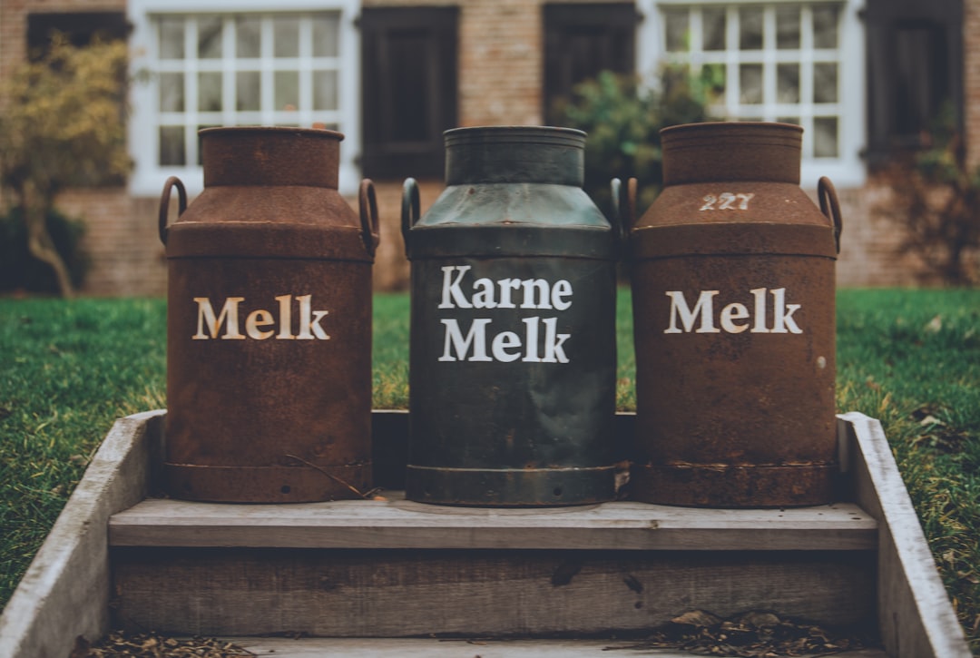  three brown and black milk urns churner