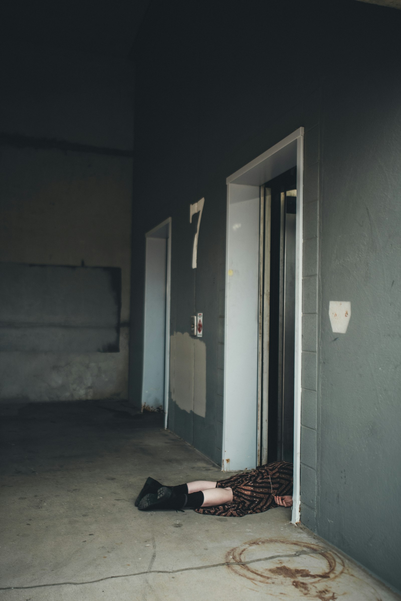 Nikon D810 sample photo. Person lying on doorway photography