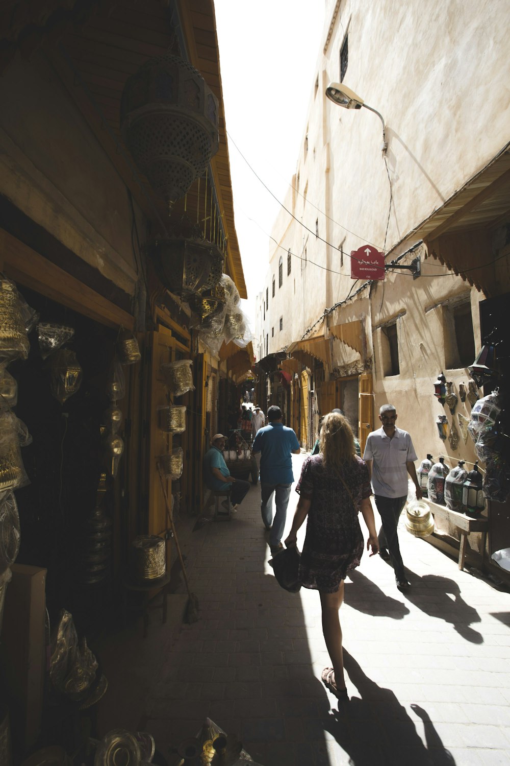 people walking between buildings