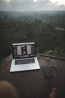 MacBook Pro beside black iPhone