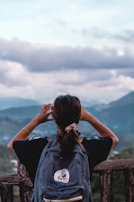 person carrying backpack