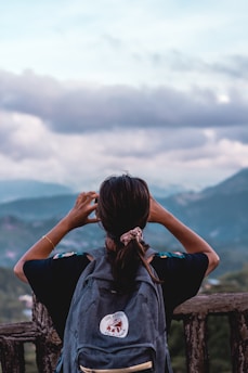 person carrying backpack