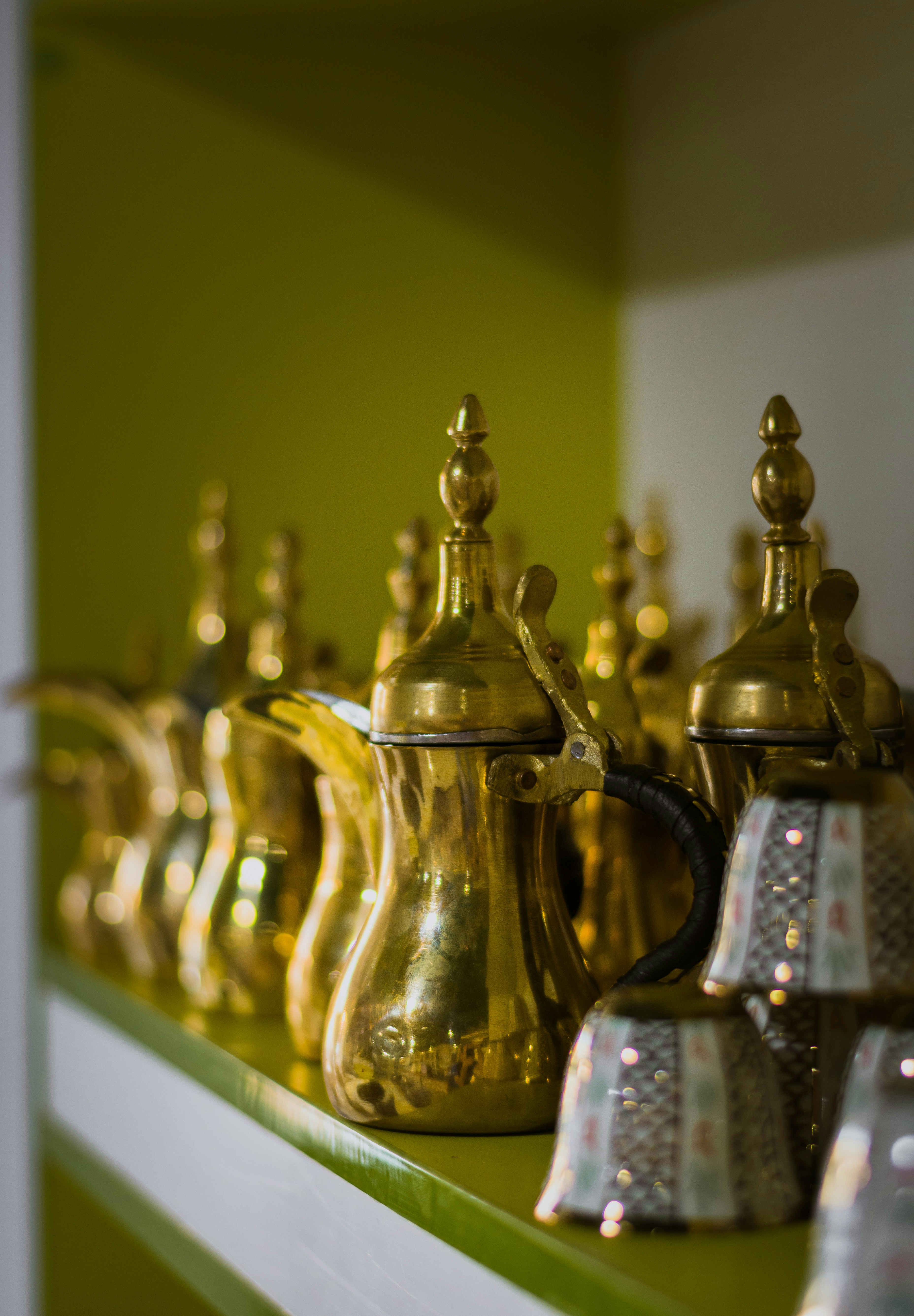 brass-colored teapot