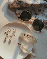 earrings and hair clip on plate