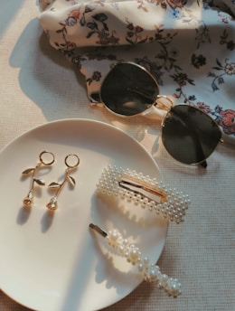 earrings and hair clip on plate