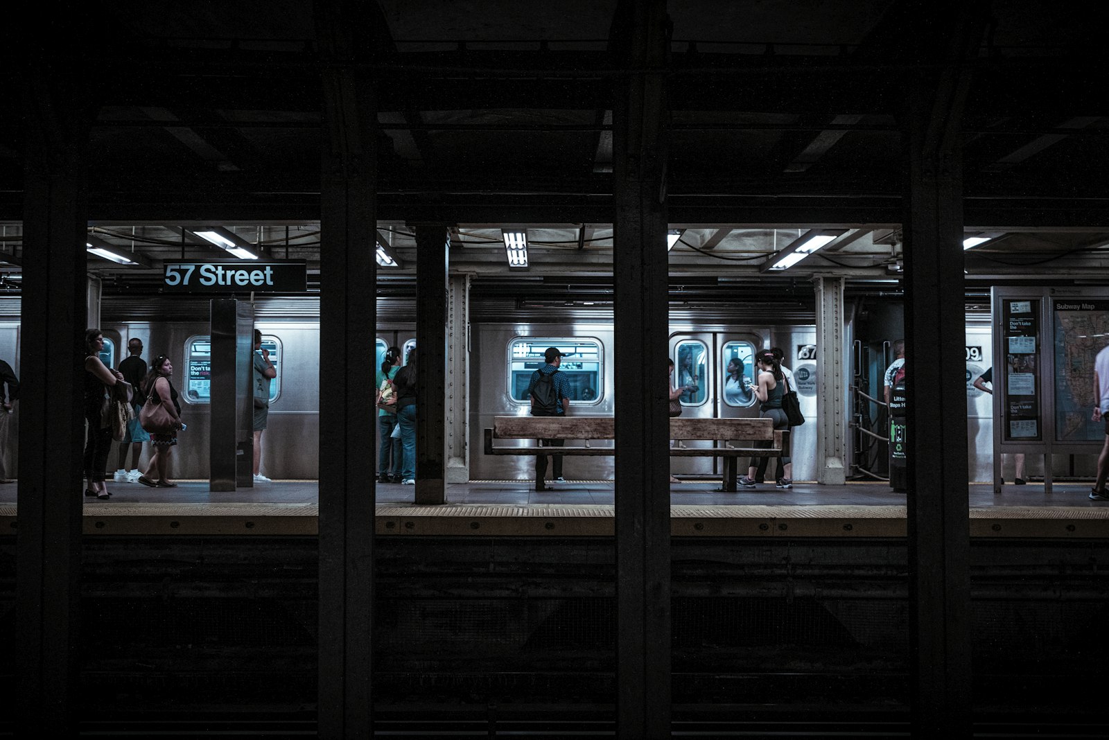 Sony a7R + Sony FE 28-70mm F3.5-5.6 OSS sample photo. People standing under railway photography