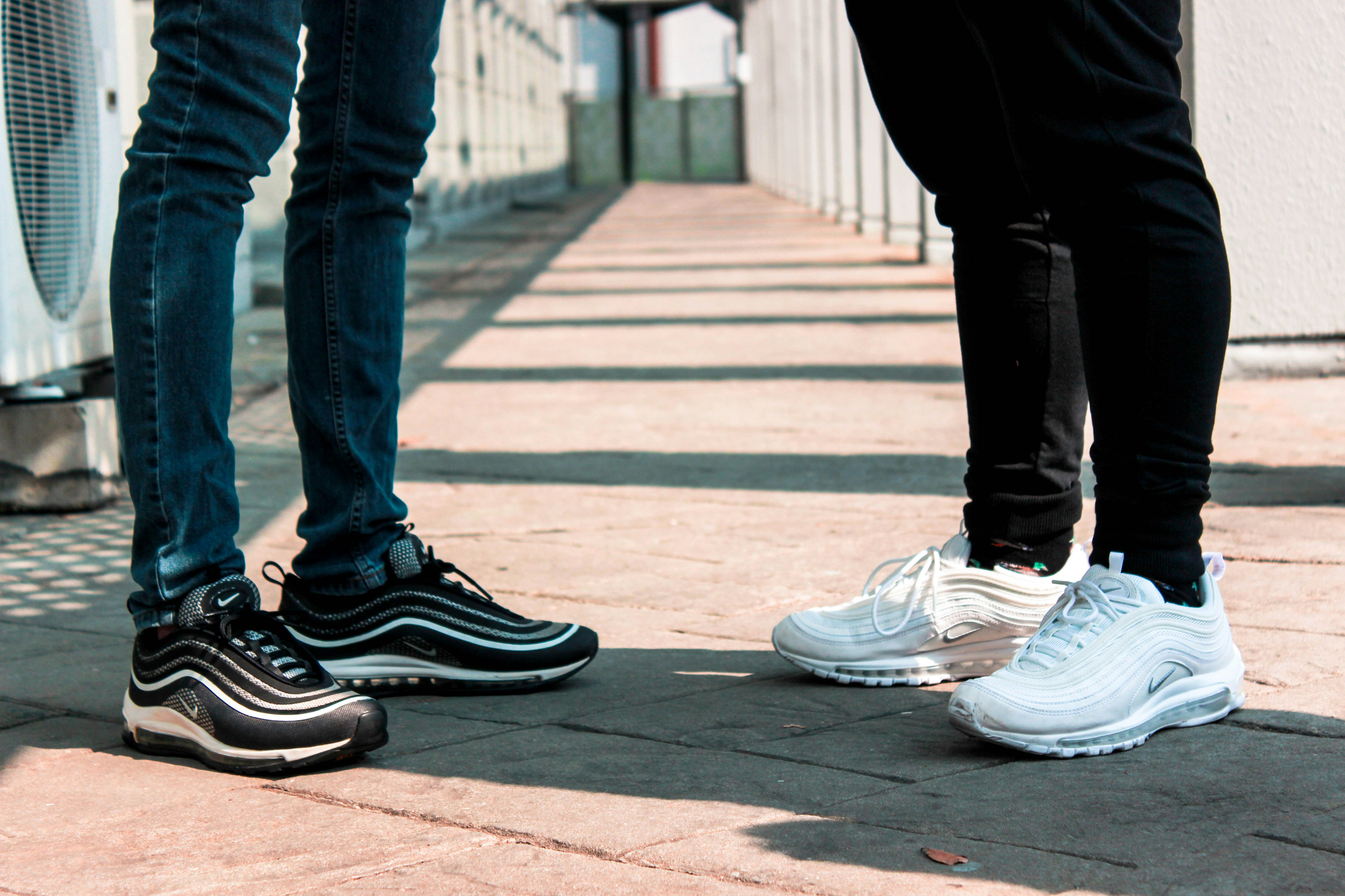 people wearing black air forces
