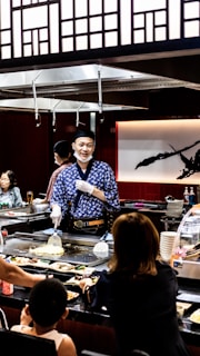 Chef El Ninja interacting with guests at one of his restaurants.