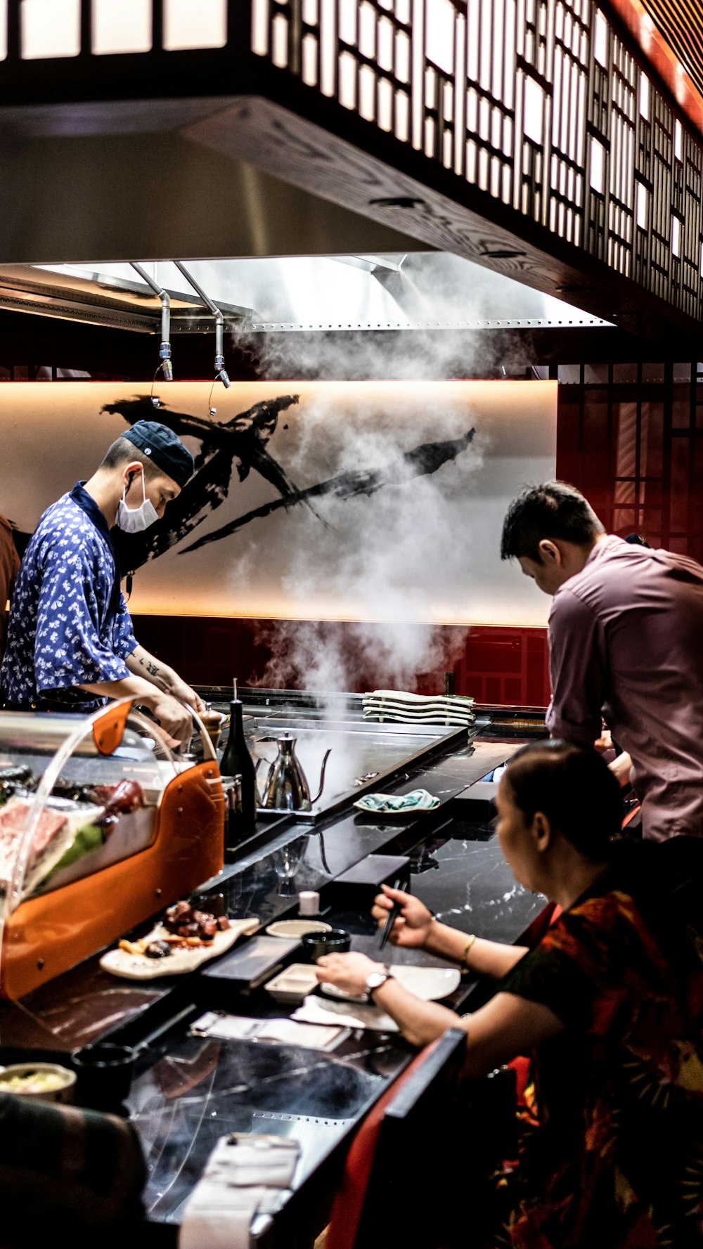 men and woman cooking