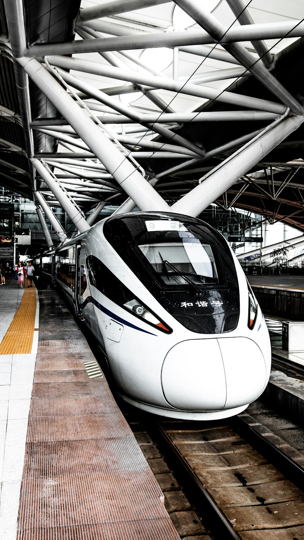 white train at the station during daytime