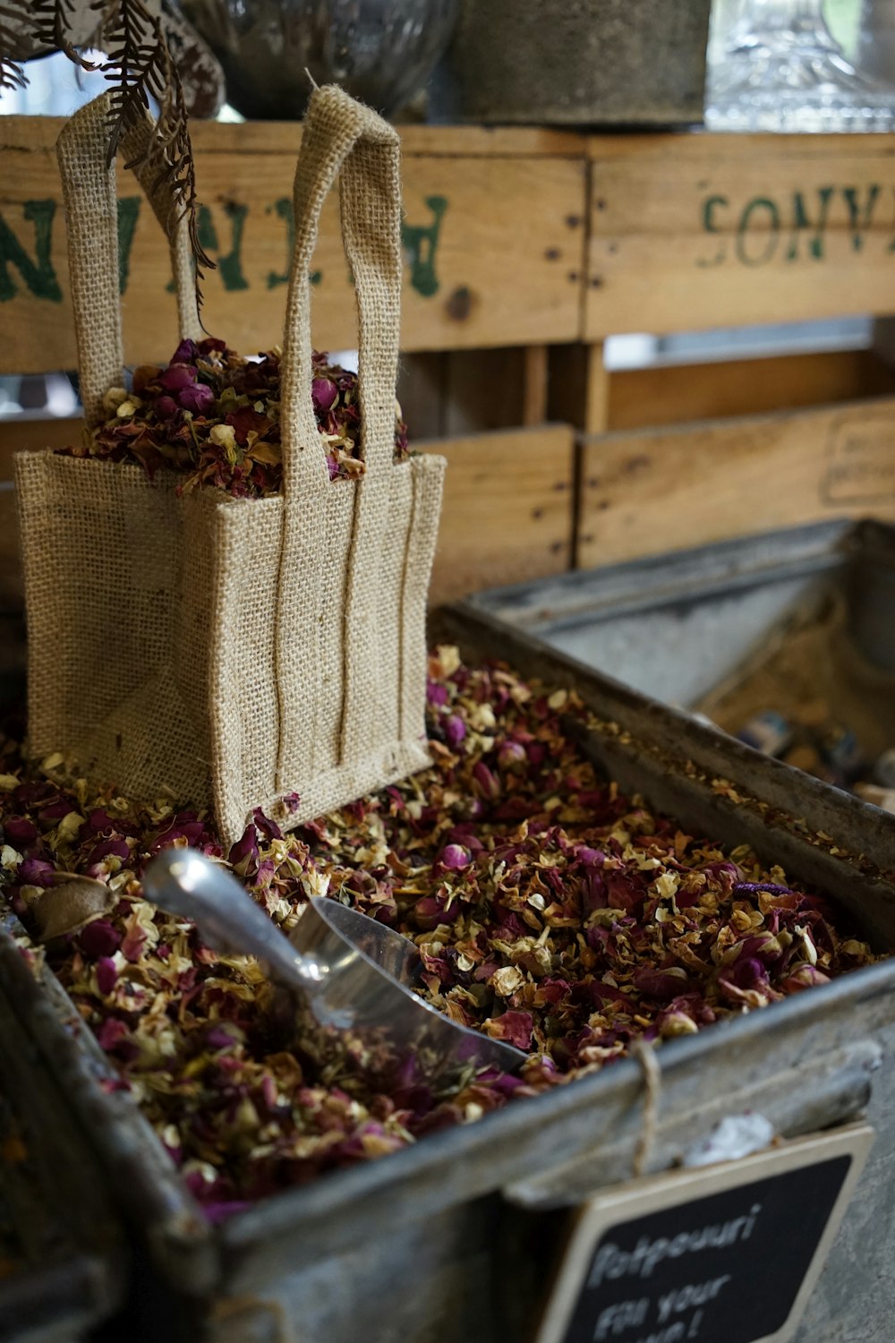 a bag of dried flowers sitting in a bin