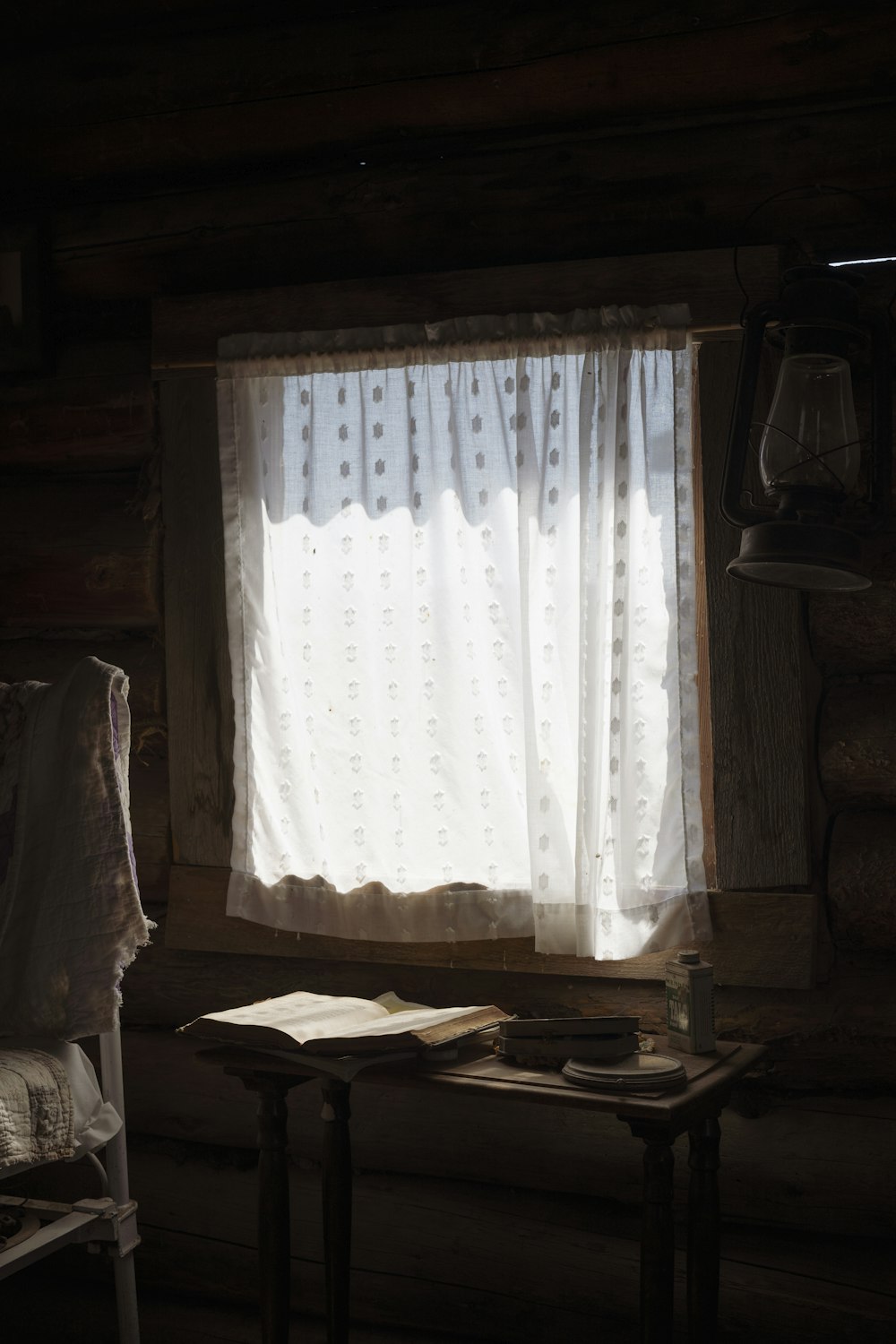 white window curtains closed in room