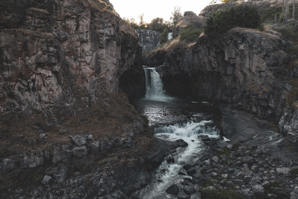 blue waterfall during daytime