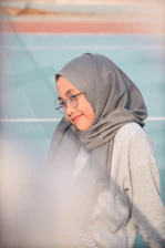 woman wearing grey scarf
