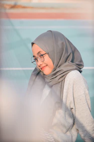woman wearing grey scarf