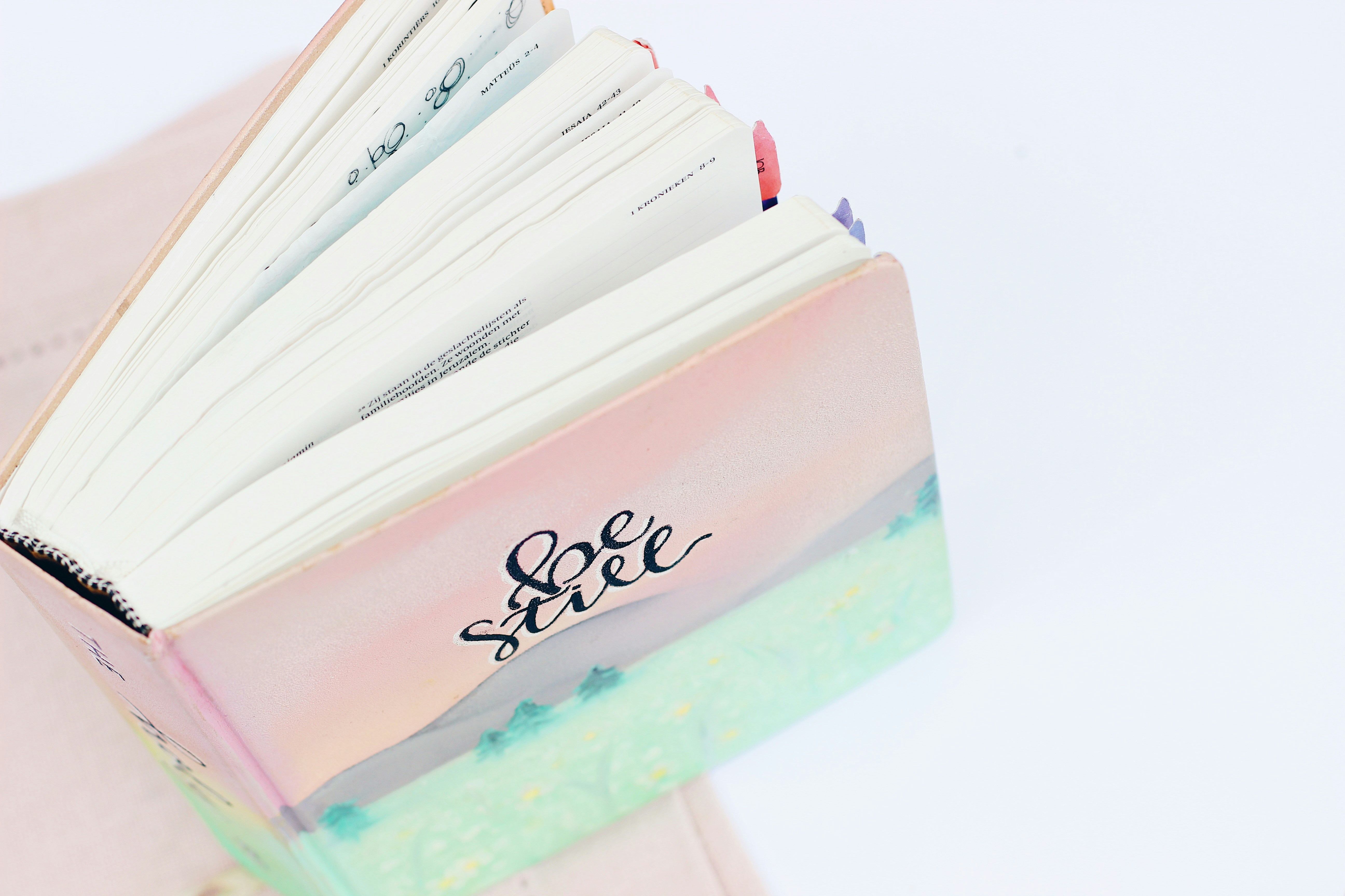 pink and blue printed notepad