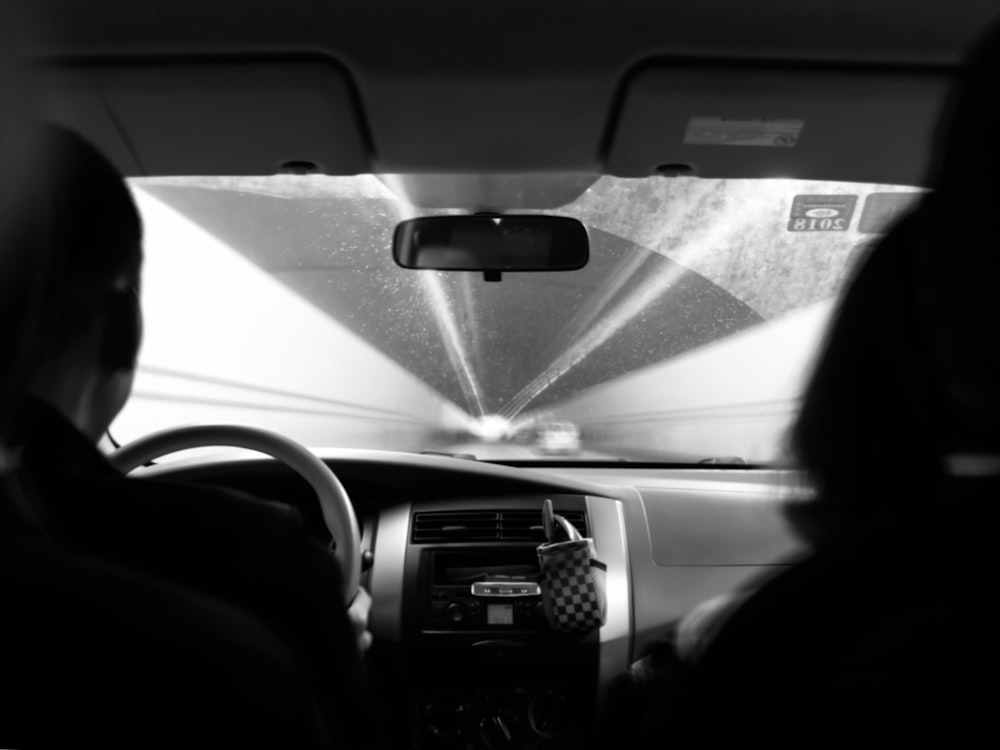 a view of the inside of a car from the driver's seat