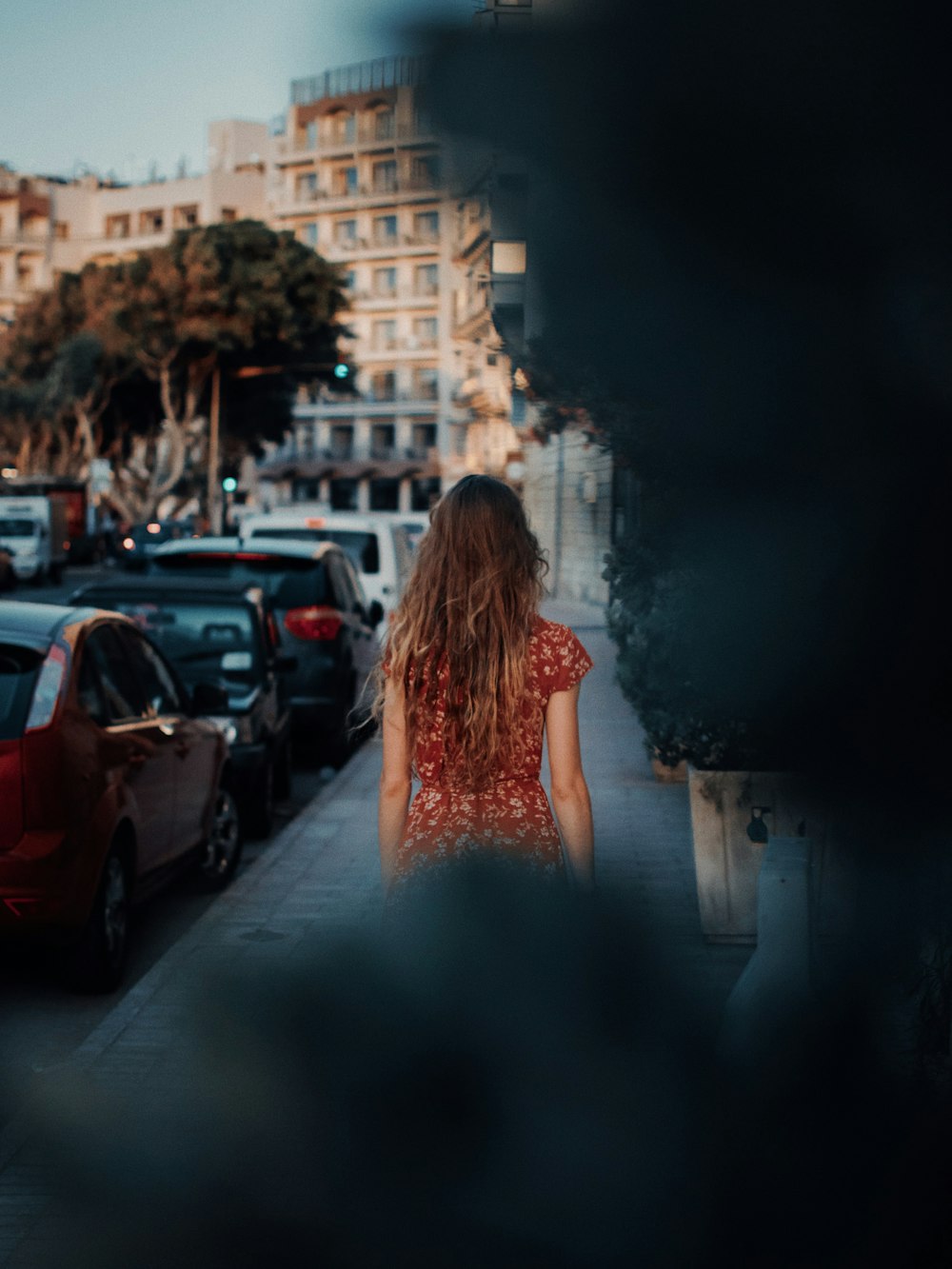 woman walking on sidewalk