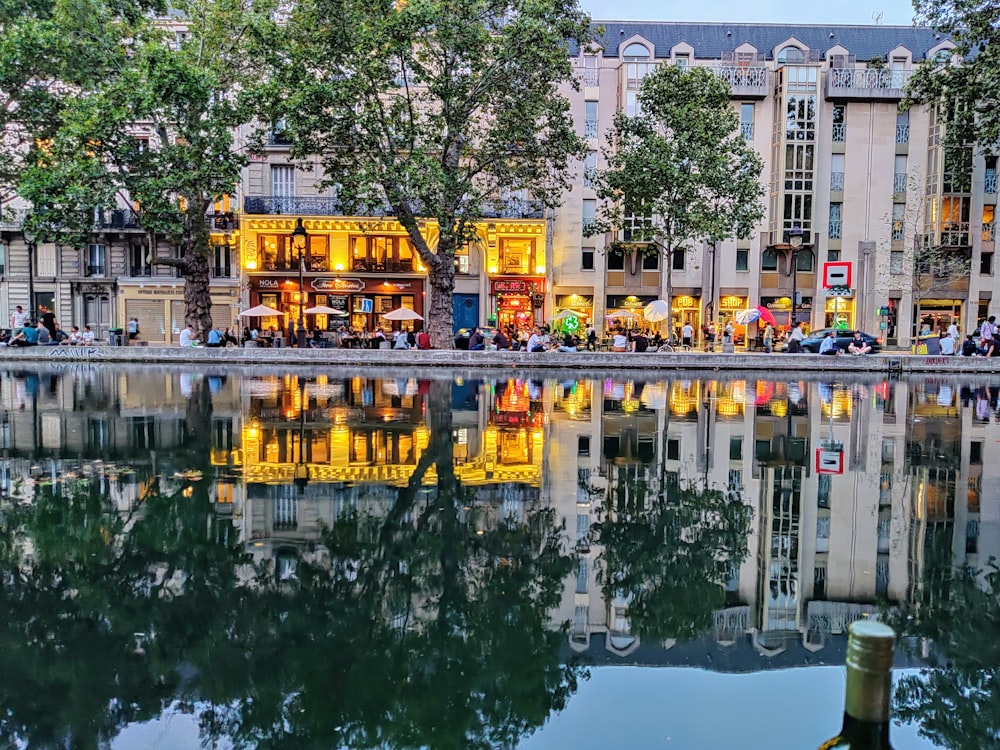 body of water near people and building