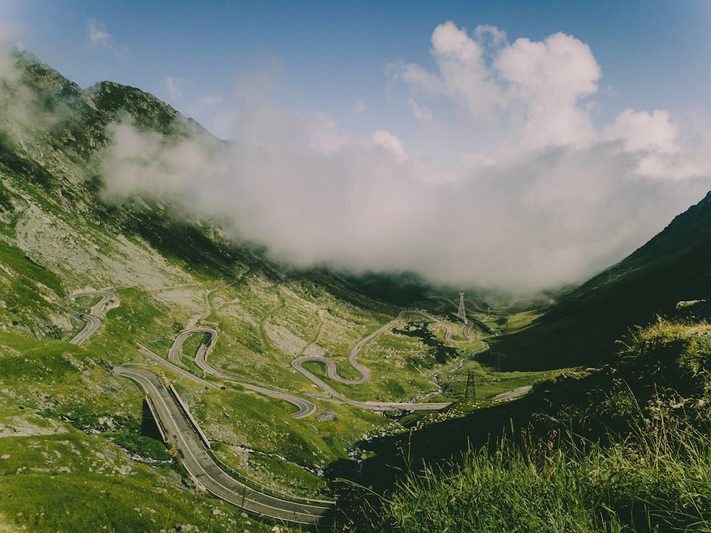 aerial view of snake road across clouds