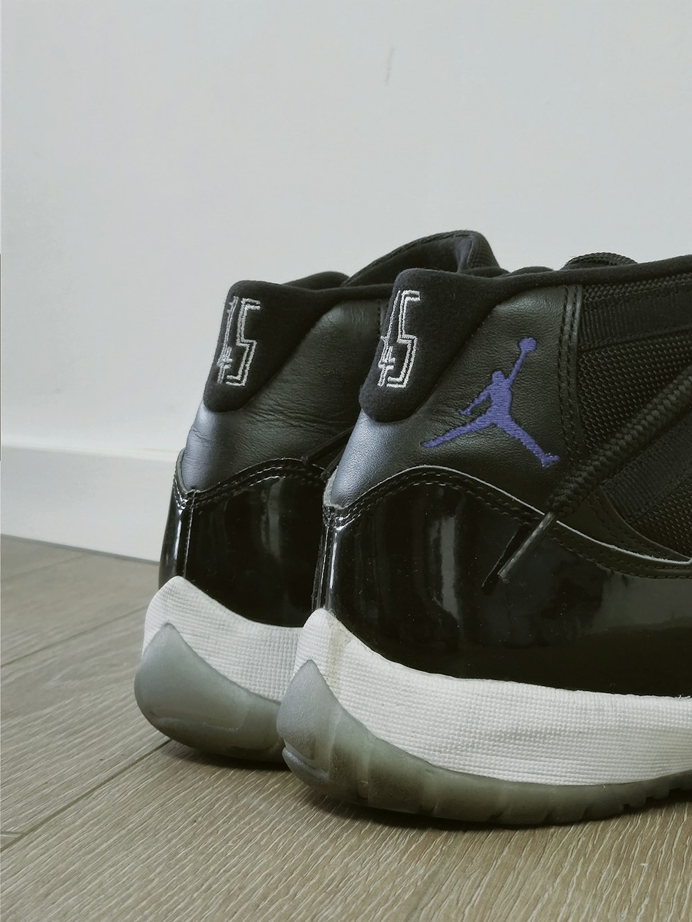 pair of black Air Jordan basketball shoes