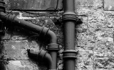 greyscale photography of pipe