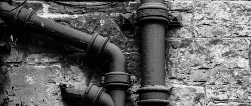 greyscale photography of pipe