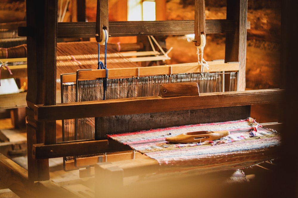 a weaving machine with a piece of cloth on it