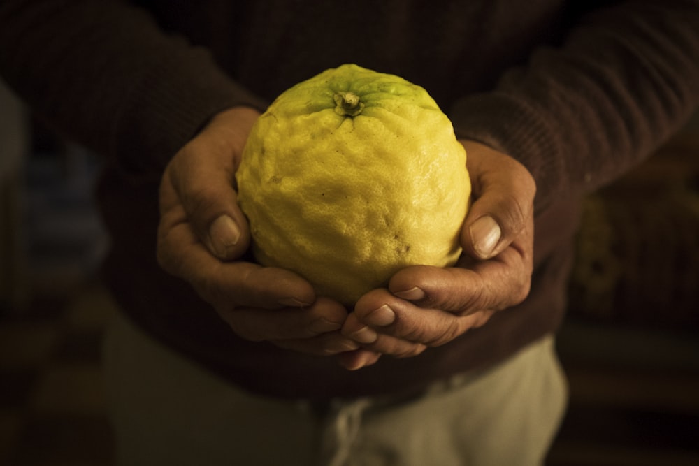 man holding a fruit