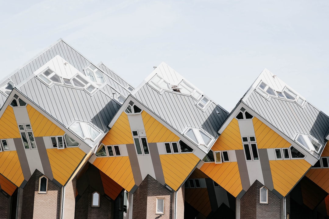 architectural photography of yellow, gray, and white house