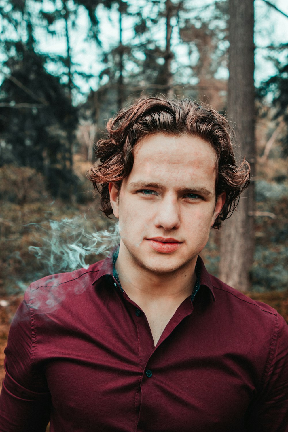 man in red button-up collared top