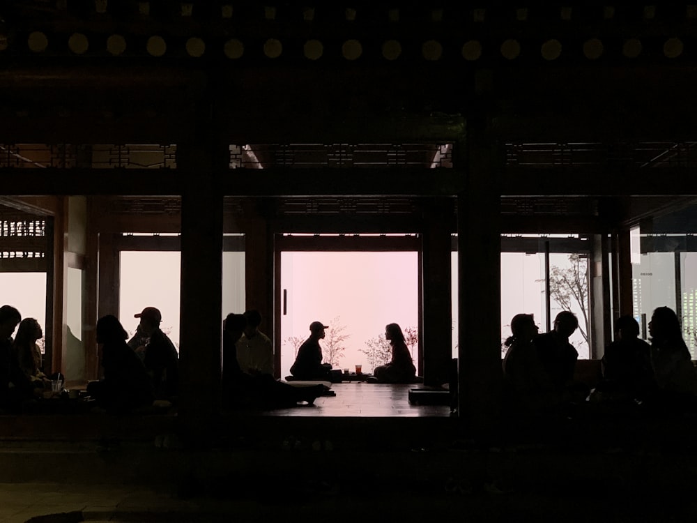 group of people sitting inside the room