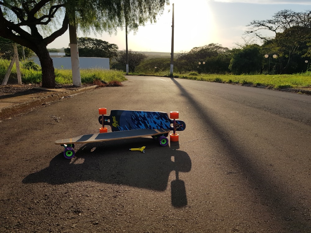 two assorted-color longboards on road