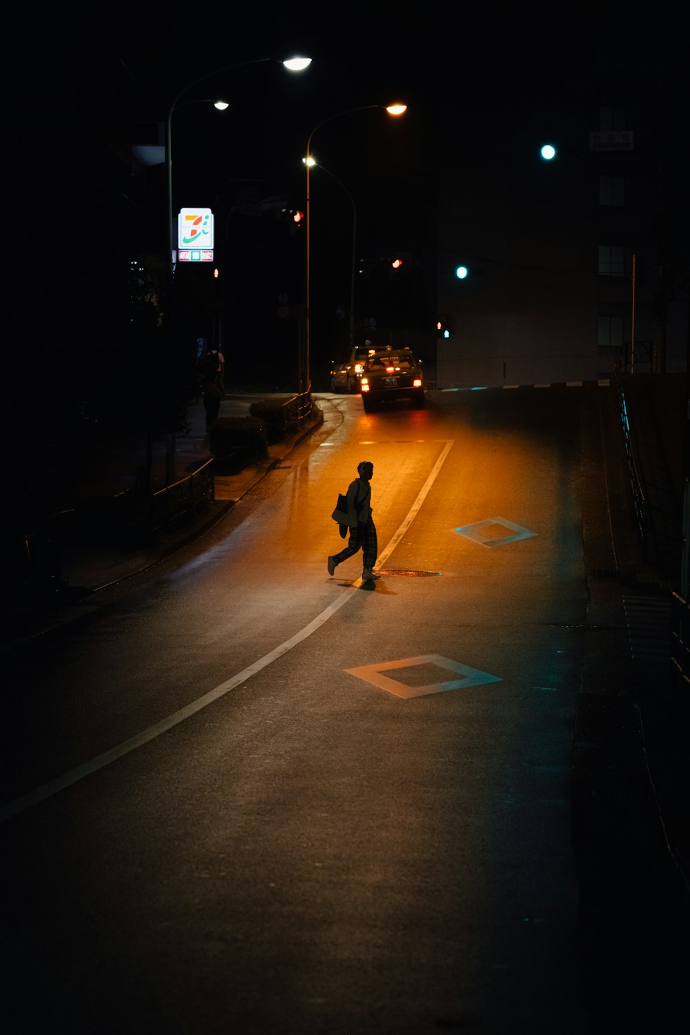 person walking on road