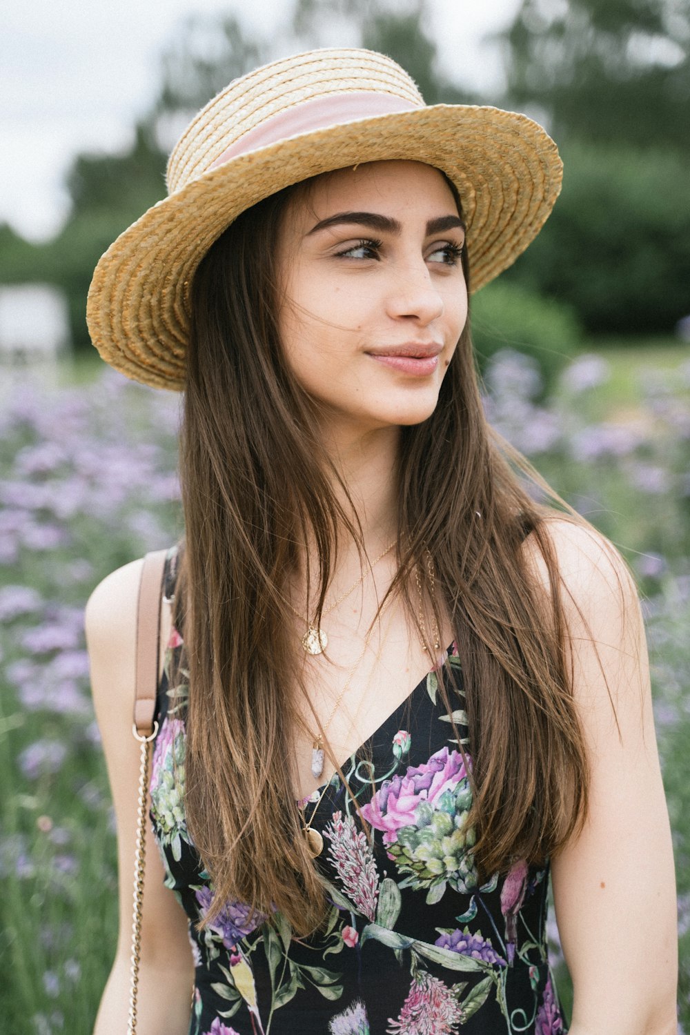 women's black and multicolored floral sleeveless top close-up photography