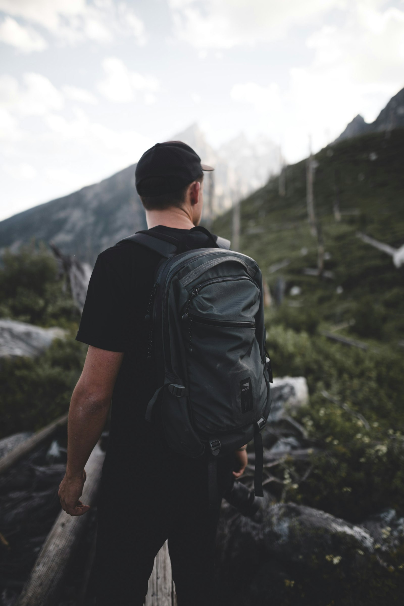 Canon EOS 6D + Sigma 24mm F1.4 DG HSM Art sample photo. Man standing near mountain photography