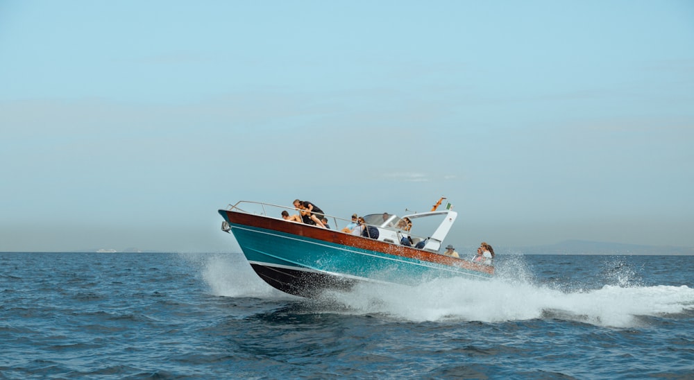 blue speed boat on water
