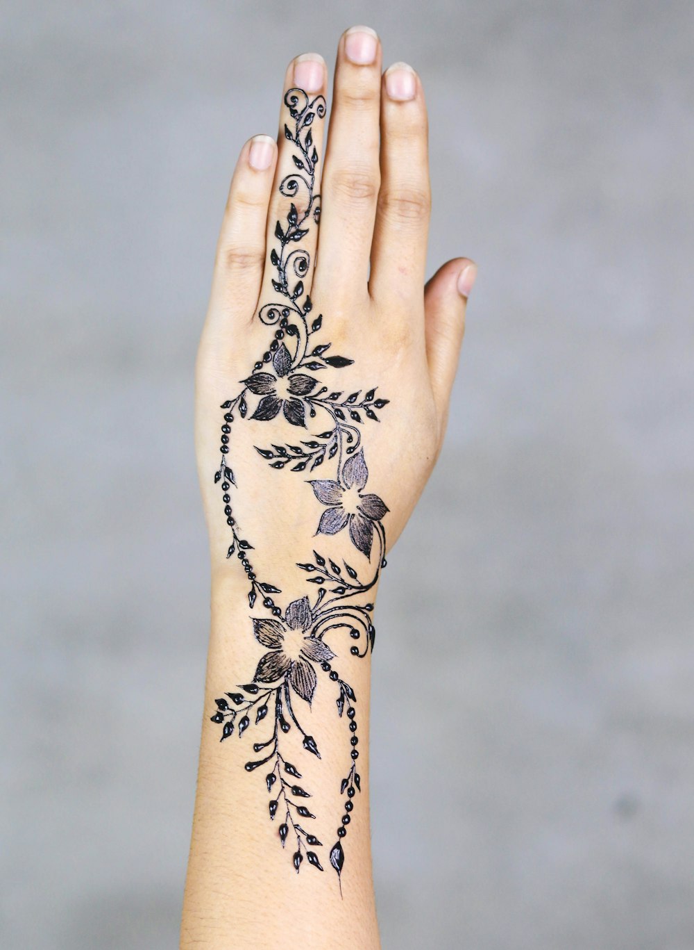 flowers hand tattoo