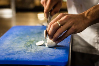 man slicing onion
