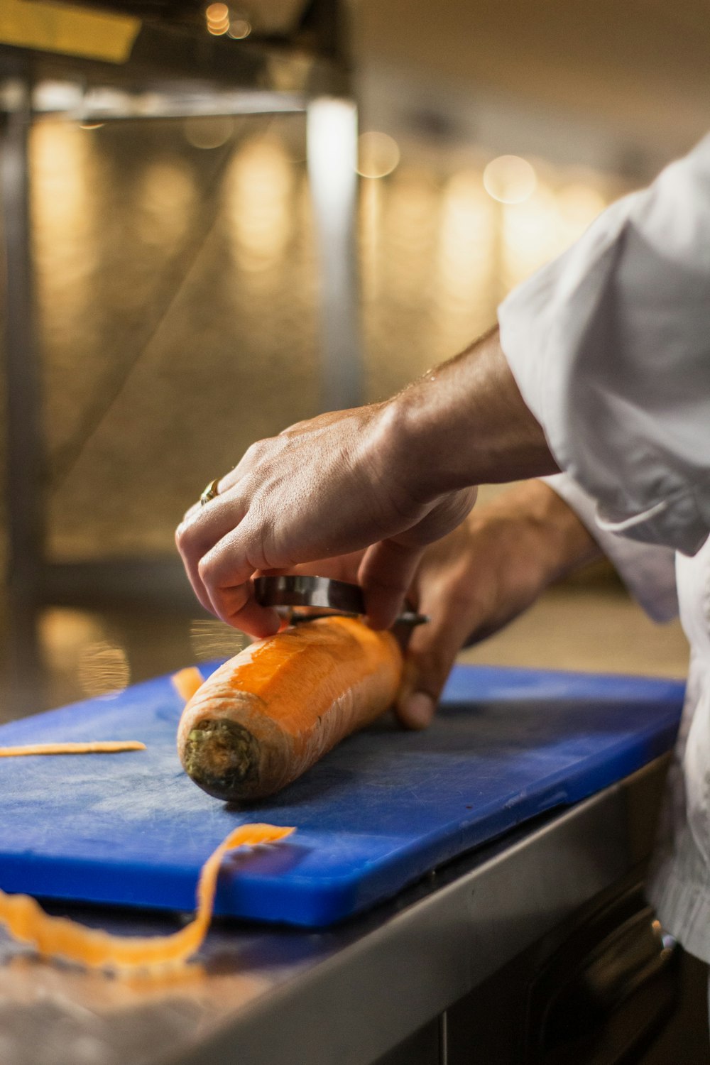 man peeling carrot