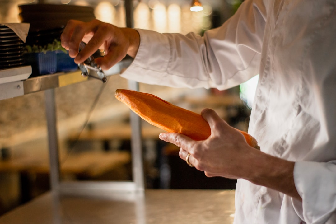 man holding carrot