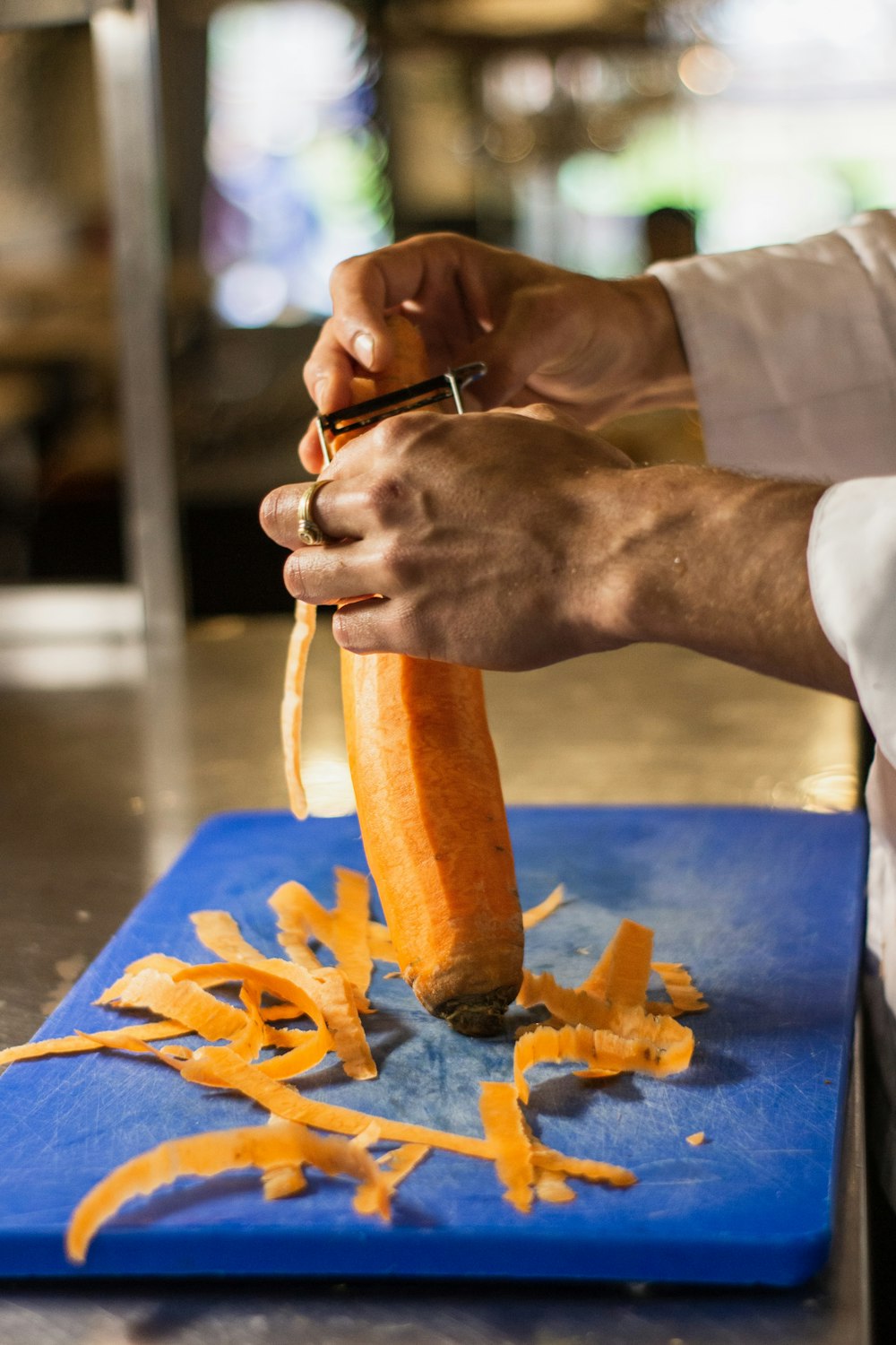 man peeling carrot