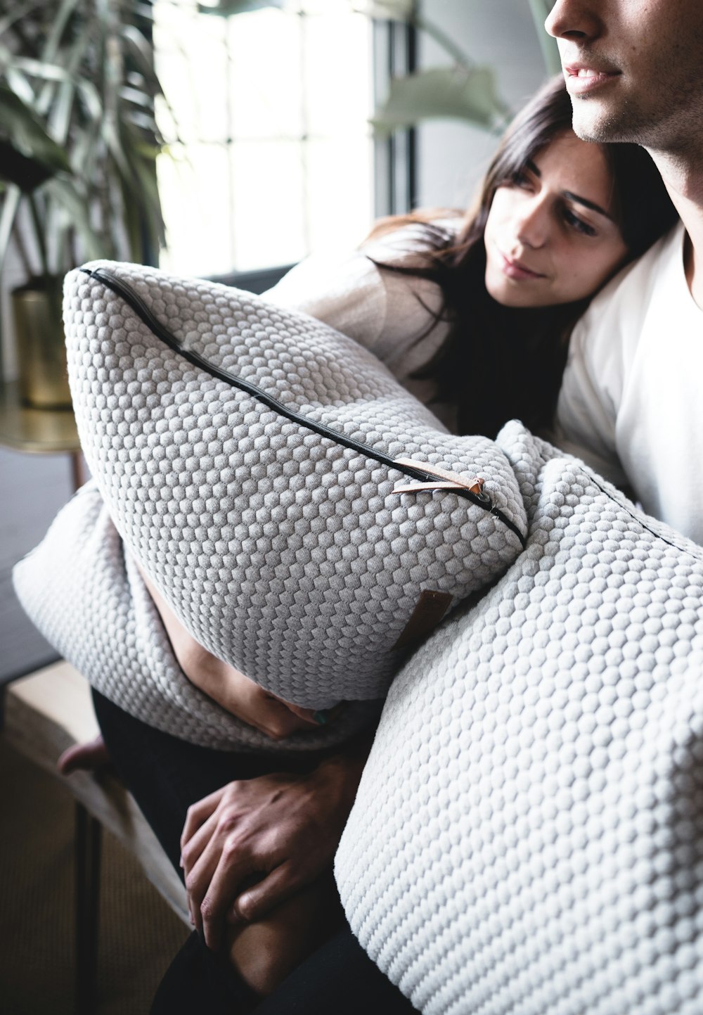 person hugging pillow